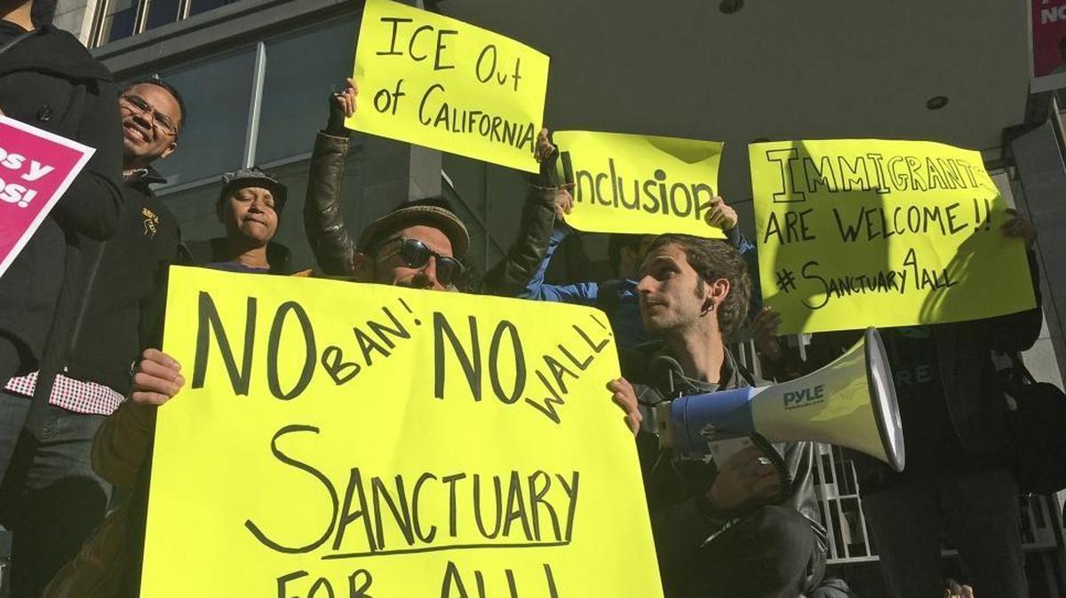 Protesters outside a San Francisco courthouse last year, site of a hearing of the first lawsuit challenging the government’s ability to withhold grants from sanctuary cities.