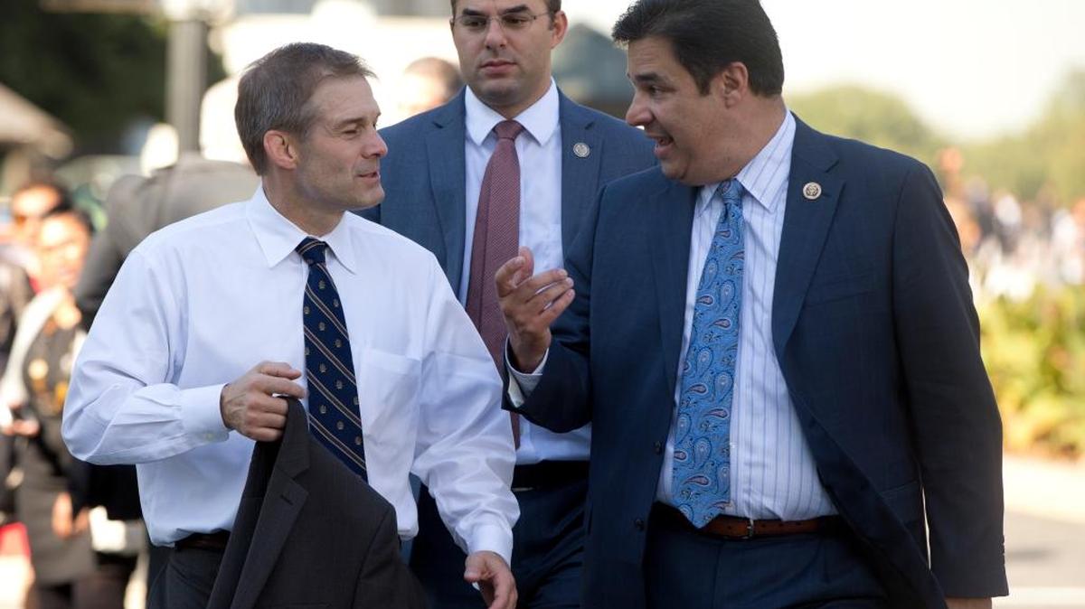 Rep. Raul Labrador, R-Idaho, right, speaks with Rep. Jim Jordan, R-Ohio, left, and Rep. Justin Amash, R-Mich., center, near the Capitol in Washington, D.C., on Oct. 21, 2015.