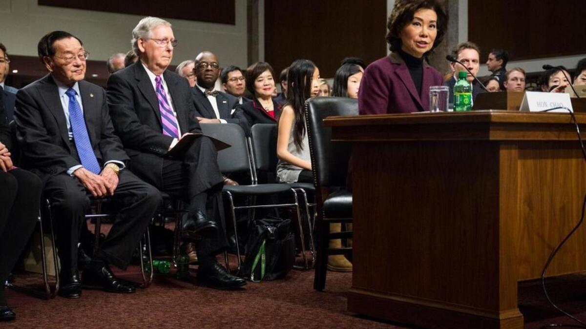 In 2017, Elaine Chao testified at her confirmation hearing before the Senate Commerce Committee, as her father, James Chao, and her husband, Senate Majority Leader Mitch McConnell of Kentucky, listened.