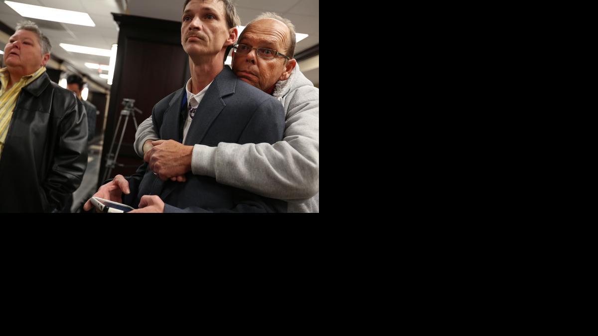 
John Humphrey, left, and James Strawser wait for a marriage license along with several other gay couples at the Mobile County Probate office in Mobile, Ala., on Tuesday, Feb. 10, 2015. A federal judge’s ruling went into effect Monday overturning Alabama’s ban on gay marriage after the U.S. Supreme Court refused the state’s request to stop the marriages. Alabama Chief Justice Roy Moore directed probate judges to refuse the licenses and resist what he called an “illegal” intrusion by the federal court.
