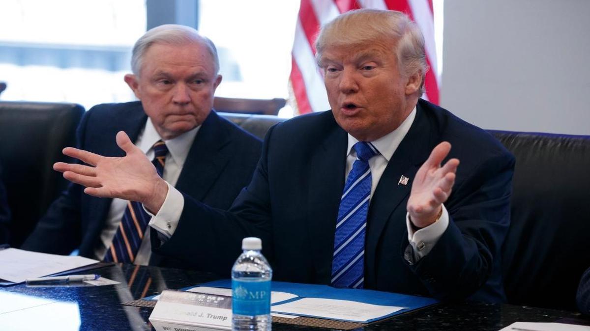 Supporters of marijuana legalization fear that Sen. Sen. Jeff Sessions, R-Ala., at left, will lead a crackdown against their movement if he’s confirmed as the next U.S. attorney general. In this photo, taken Oct. 7, 2016, Sessions listened as President-elect Donald Trump spoke during a national security meeting with advisers at Trump Tower in New York.