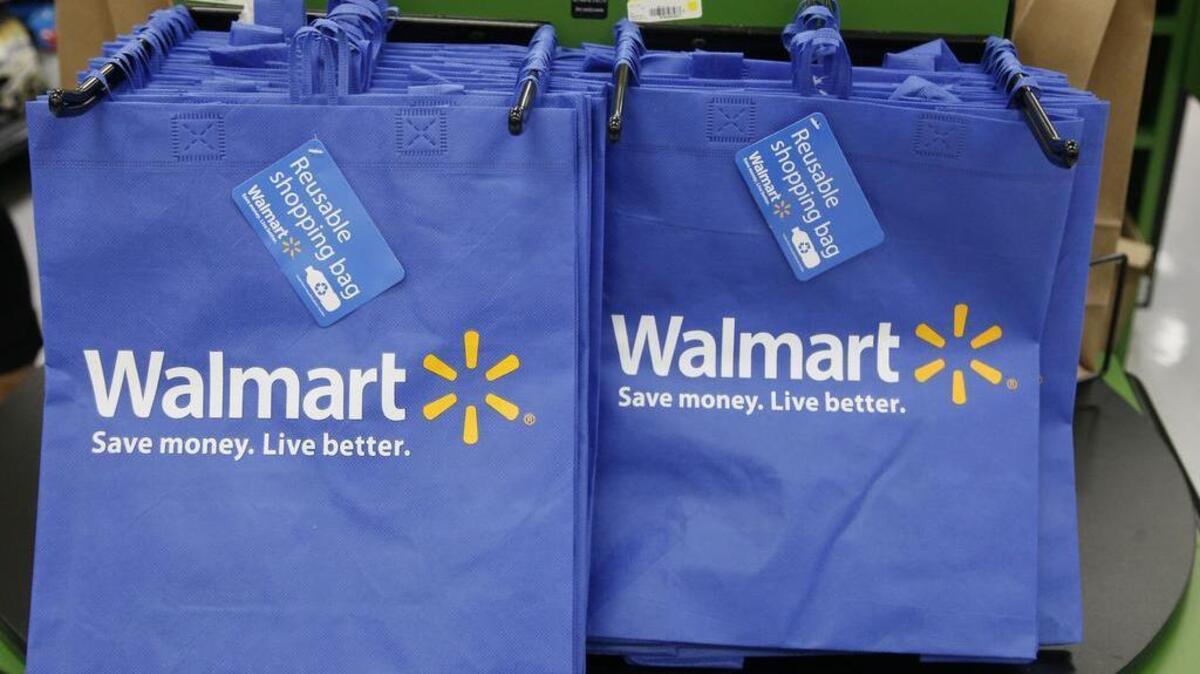 FILE - In this Thursday, Sept. 19, 2013, file photo, reusable shopping bags are offered for sale at a Wal-Mart Neighborhood Market, in the Chinatown district of Los Angeles.