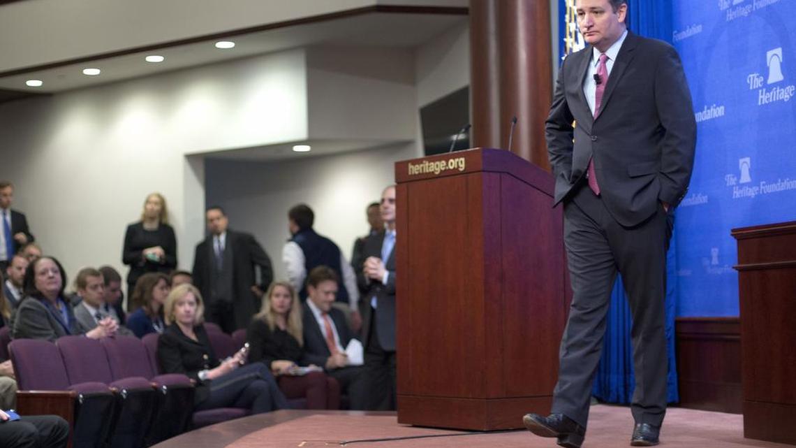 Republican presidential candidate Sen. Ted Cruz, R-Texas, walks across the stage to answers question from members of audience at the Heritage Foundation in Washington, Thursday, Dec. 10, 2015.