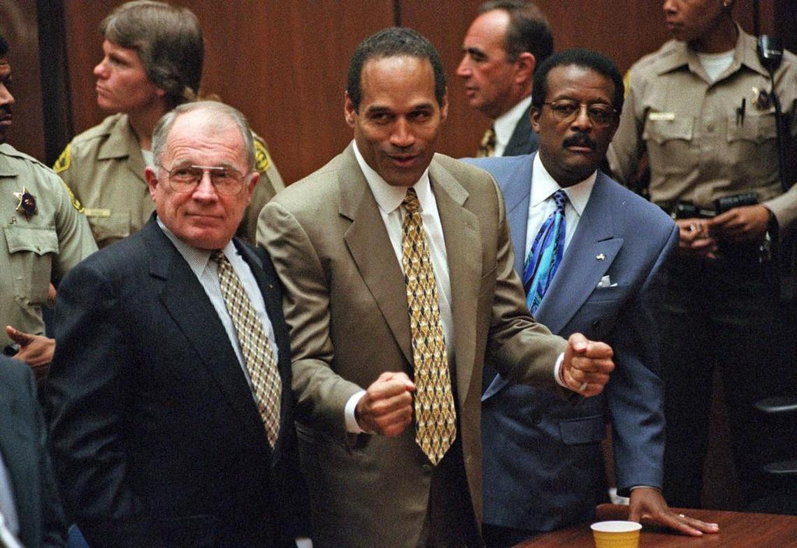 Defense attorney F. Lee Bailey, left, stands with O.J. Simpson on Oct. 3, 1995, as Simpson is found not guilty of murdering his ex-wife, Nicole Brown Simpson, and her friend Ron Goldman.