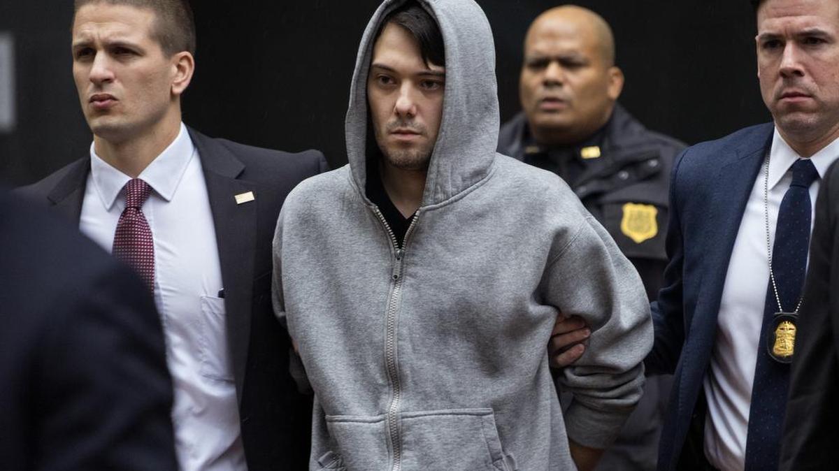 Martin Shkreli, the former hedge fund manager under fire for buying a pharmaceutical company and ratcheting up the price of a life-saving drug, is escorted by law enforcement agents in New York on Thursday, after being taken into custody following a securities probe. A seven-count indictment unsealed in Brooklyn federal court Thursday charged Shkreli with conspiracy to commit securities fraud, conspiracy to commit wire fraud and securities fraud.