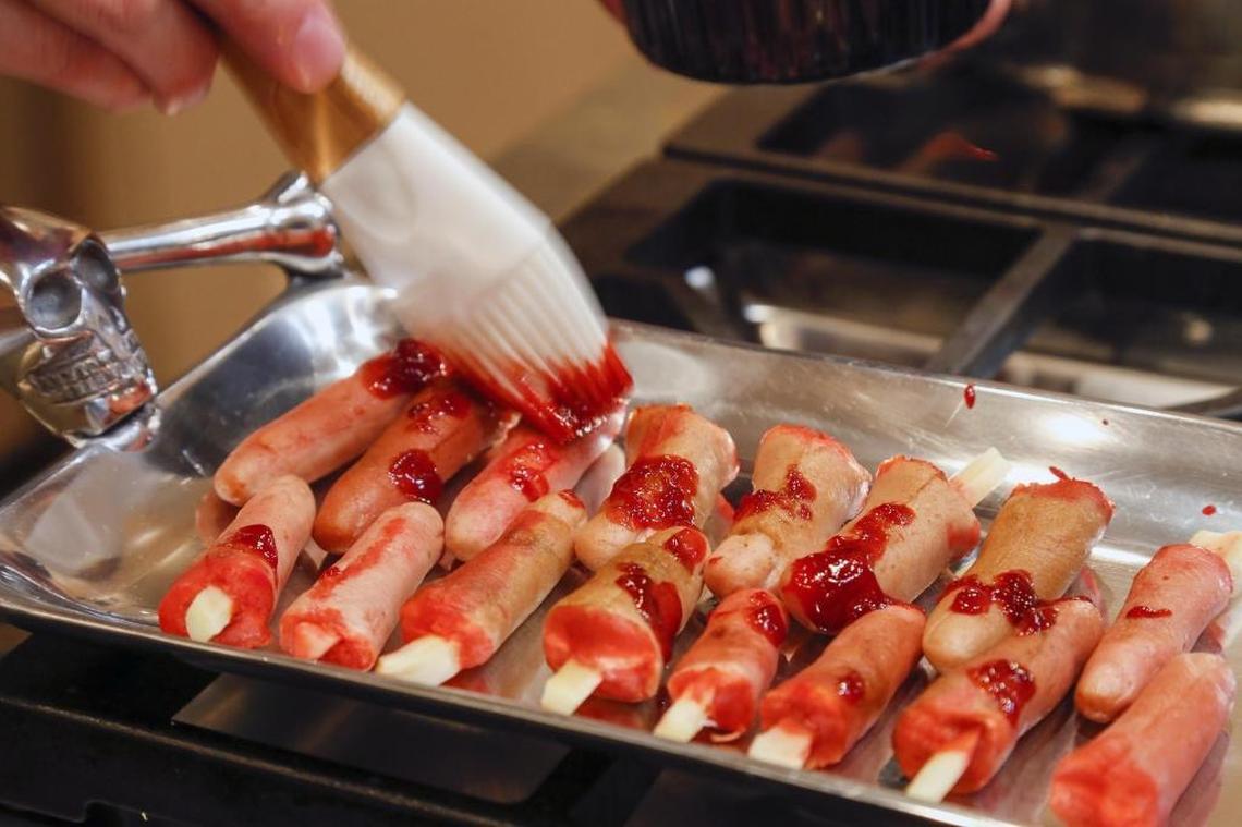 One of food blogger Beckie Lombardi’s most creepy — and creative — recipes is Cannibal Quality Finger Food, a deviled ham appetizer. Once she fills her finger molds, she paints them with sauce accented with food coloring.