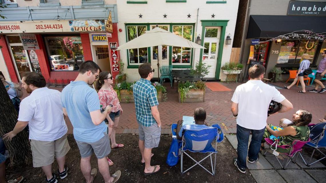 Customers line up to snag a table for dinner at Rose's Luxury in Washington DC. They restaurant's owners have a new venture, Pineapple and Pearls, that will sell timed tickets letting guests select where they want to sit.