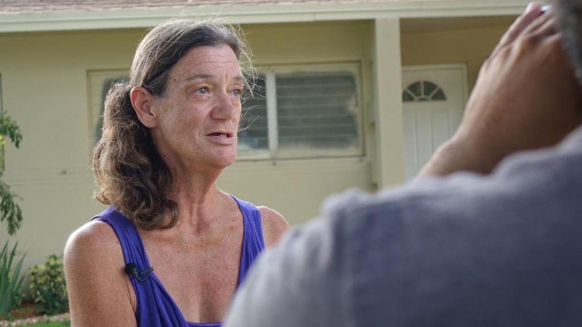 Linda Cleland, 60, stands outside her Northwest Hialeah house. She was homeless for seven months after swindlers used forged quitclaim deeds to steal the home.