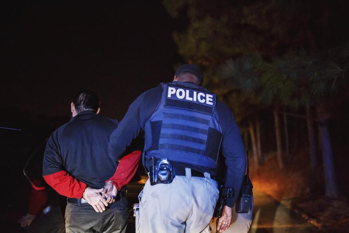 Immigration and Customs Enforcement officers arrest David Martinez-Samano in Norcross, Ga., a suburb of Atlanta, Oct. 19, 2017. Few places simultaneously beckon and punish undocumented immigrants more than Atlanta, a boomtown of construction and service jobs where conservative politics has turned every waking day into a gamble.