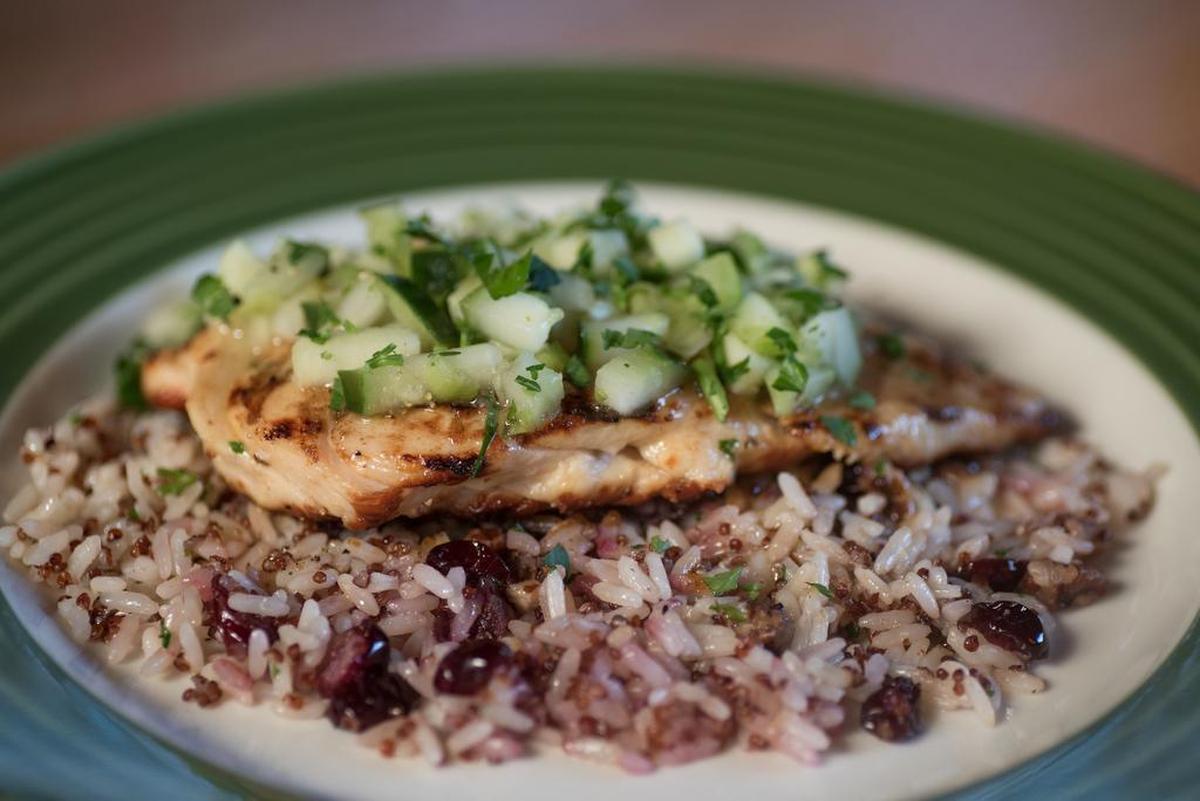Cedar-grilled lemon chicken sits on a bed of quinoa jazzed up with dried cranberries at Applebee's.
