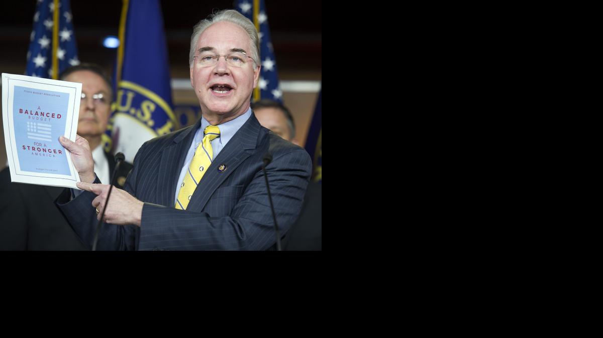 
In this March 17, 2015, photo, House Budget Committee Chairman Rep. Tom Price, R-Ga. holds-up a synopsis of the House Republican budget proposal as he announces the plan on Capitol Hill in Washington. The new House and Senate Republican boast that they both balance the federal budget within 10 years, without raising taxes. Their own numbers, however, say millions of American families and businesses would have to pay more in taxes to make the math work. To the tune of about $900 billion more over the next decade. 
