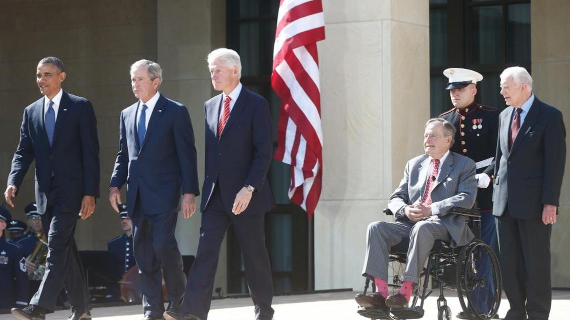 President Barack Obama walks with former presidents George W. Bush, Bill Clinton, George H.W. Bush, and Jimmy Carter at the dedication of the George W. Bush presidential library on the campus of Southern Methodist University in Dallas, Thursday, April 25, 2013.