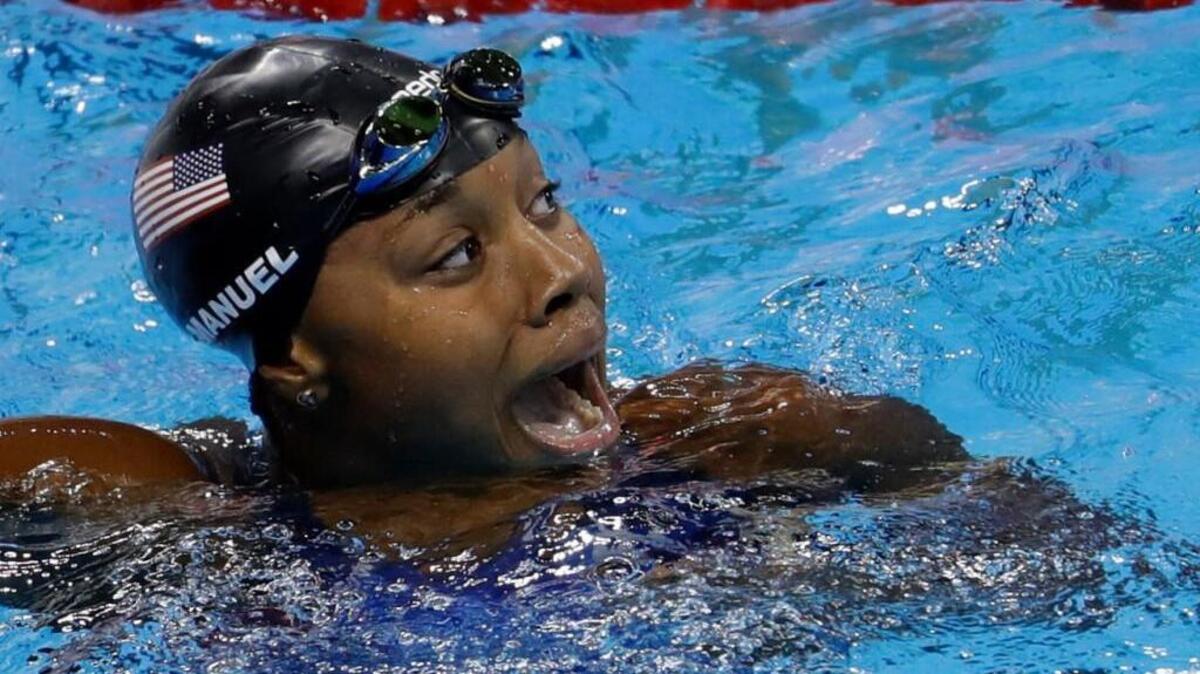 United States’ Simone Manuel celebrates winning the gold medal and setting a new olympic record in the women's 100-meter freestyle during the swimming competitions at the 2016 Summer Olympics on Thursday in Rio de Janeiro, Brazil.