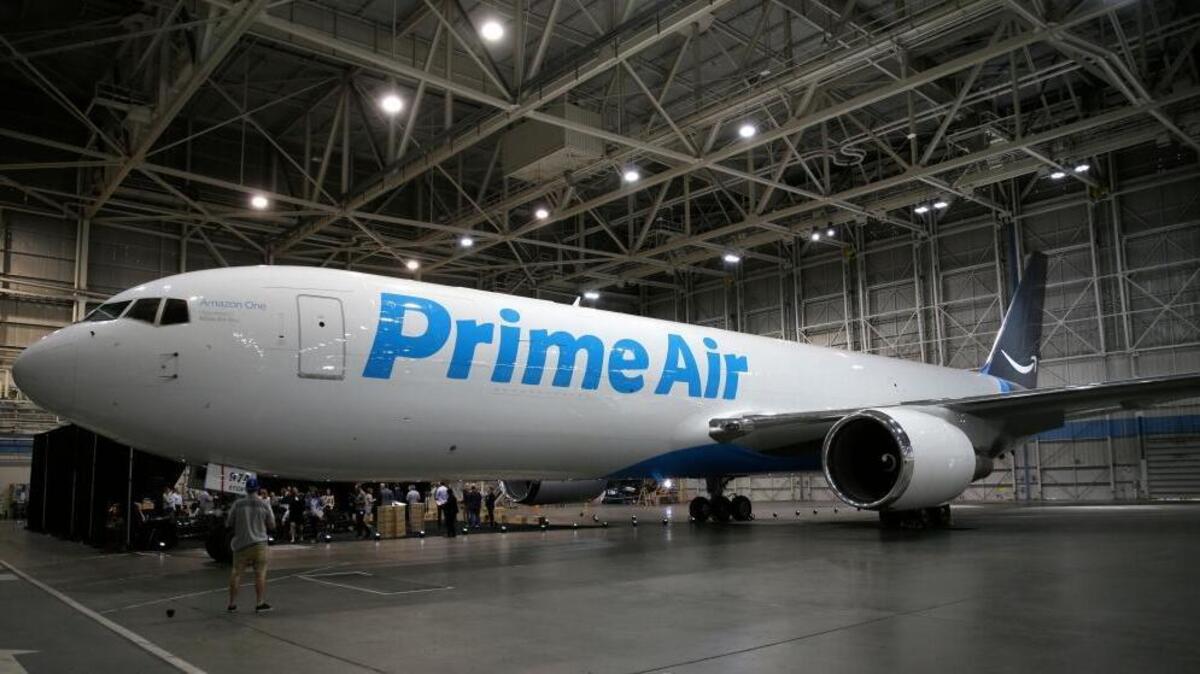 A Boeing 767, an Amazon.com "Prime Air" cargo plane is parked on display Thursday, Aug. 4, 2016, in a Boeing hangar in Seattle. Amazon unveiled its first branded cargo plane Thursday, one of 40 jetliners that will make up Amazon's own air transportation network of 40 Boeing jets leased from Atlas Air Worldwide Holdings and Air Transport Services Group Inc., which will operate the air cargo network.
