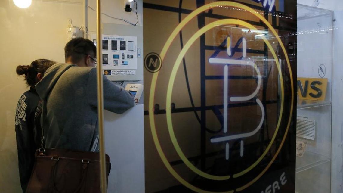 Here, people use a Bitcoin ATM in Hong Kong. The U.S. Marshals Service will be auctioning off bitcoins seized in criminal and civil asset forfeitures, though it’s unclear whether bargains will be had.