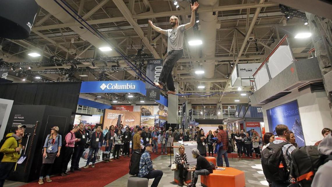 A slackliner balances amid crowds attending the Outdoor Retailer trade show at the Salt Palace Convention Center in Salt Lake City on Jan. 11, 2017. The Outdoor Industry Association decided in February to move its trade show to another state starting in 2018, to rebuff Utah’s top political leaders after they lobbied President Donald Trump to rescind the new Bears Ears National Monument designation in south Utah.