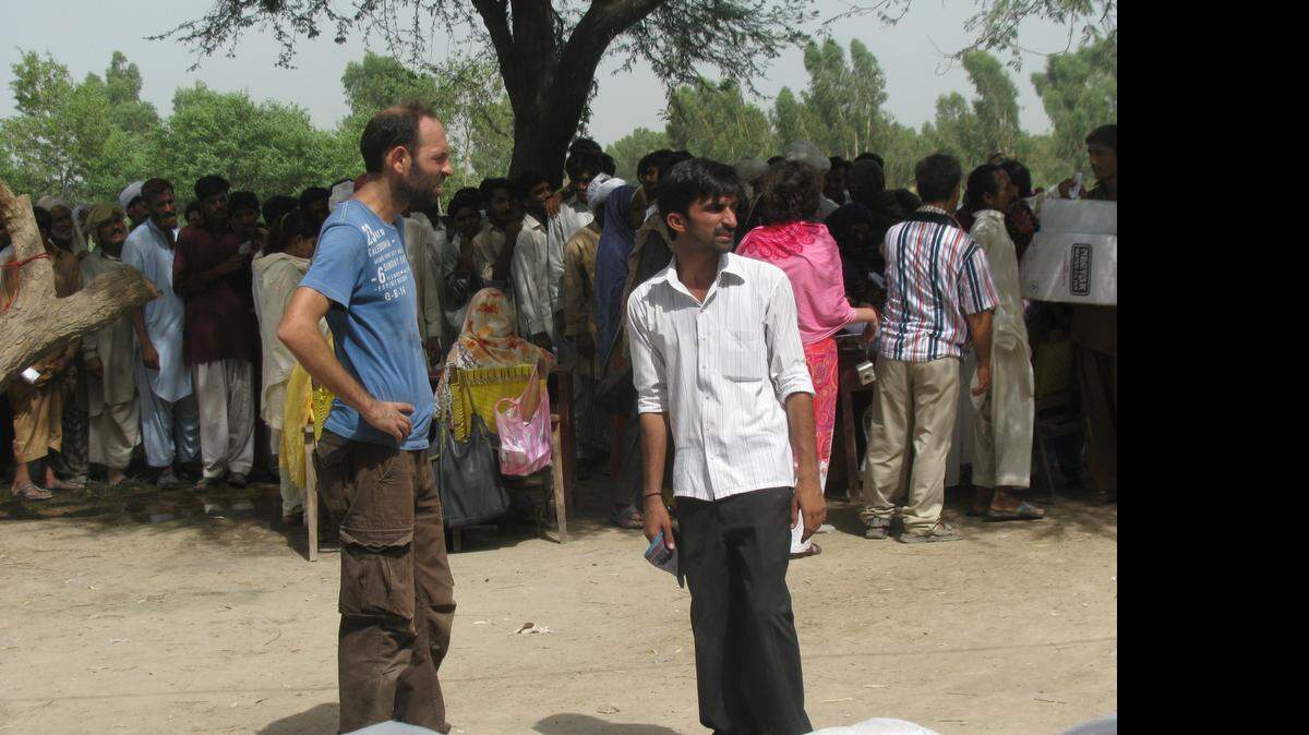 
In this May 28, 2011 photo provided by Margherita Romanelli and made available April 23, 2015, Italian aid worker Giovanni Lo Porto, left, works in Multan, Pakistan. 
