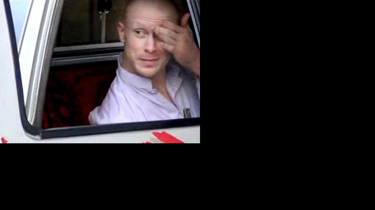 
In this file image taken from video obtained from Voice Of Jihad Website, which has been authenticated based on its contents and other AP reporting, Sgt. Bowe Bergdahl, sits in a vehicle guarded by the Taliban in eastern Afghanistan. The U.S. military says it will make an announcement Wednesday on the case against Sgt. Bowe Bergdahl, the soldier who left his post in Afghanistan and was held by the Taliban for five years before being released in a prisoner exchange.
