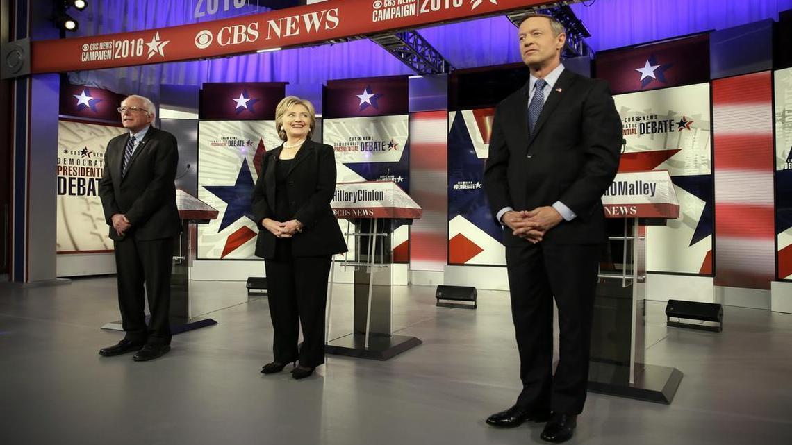 Democratic presidential candidates Bernie Sanders, Hillary Rodham Clinton and Martin O'Malley, left to right, take the stage before the Democratic presidential primary debate, Saturday, Nov. 14, 2015, in Des Moines, Iowa.