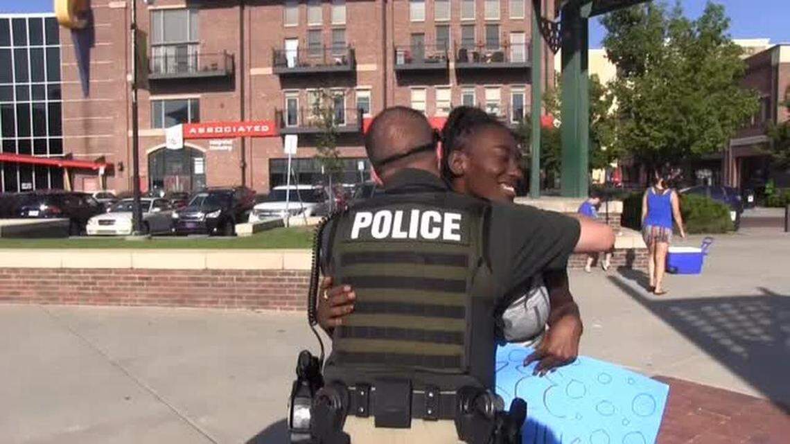 Wichita residents, including police officers and Mayor Jeff Longwell, showed up in Old Town for a "free hug" event Wednesday night.
