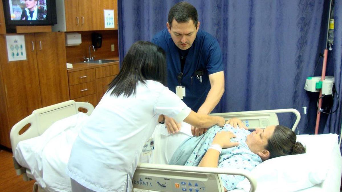 
Dr. Rolando Guerrero checks on Crystal, a Mexican woman who had an emergency cesarian section the previous day in at Starr County Memorial Hospital in Rio Grande City, Texas. 
