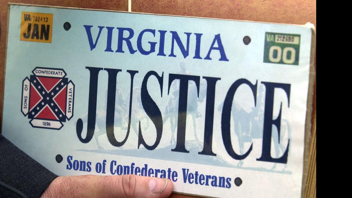 
 This 2002  photo shows a sample of the Sons of Confederate Veterans specialty Virginia state license plate. Virginia Gov. Terry McAuliffe said Tuesday, June 23, 2015 that he's moving to have the Confederate flag banished from state license plates in the wake of a massacre at a black church in Charleston, South Carolina. (Mark Gormus/Richmond Times Dispatch via AP)
