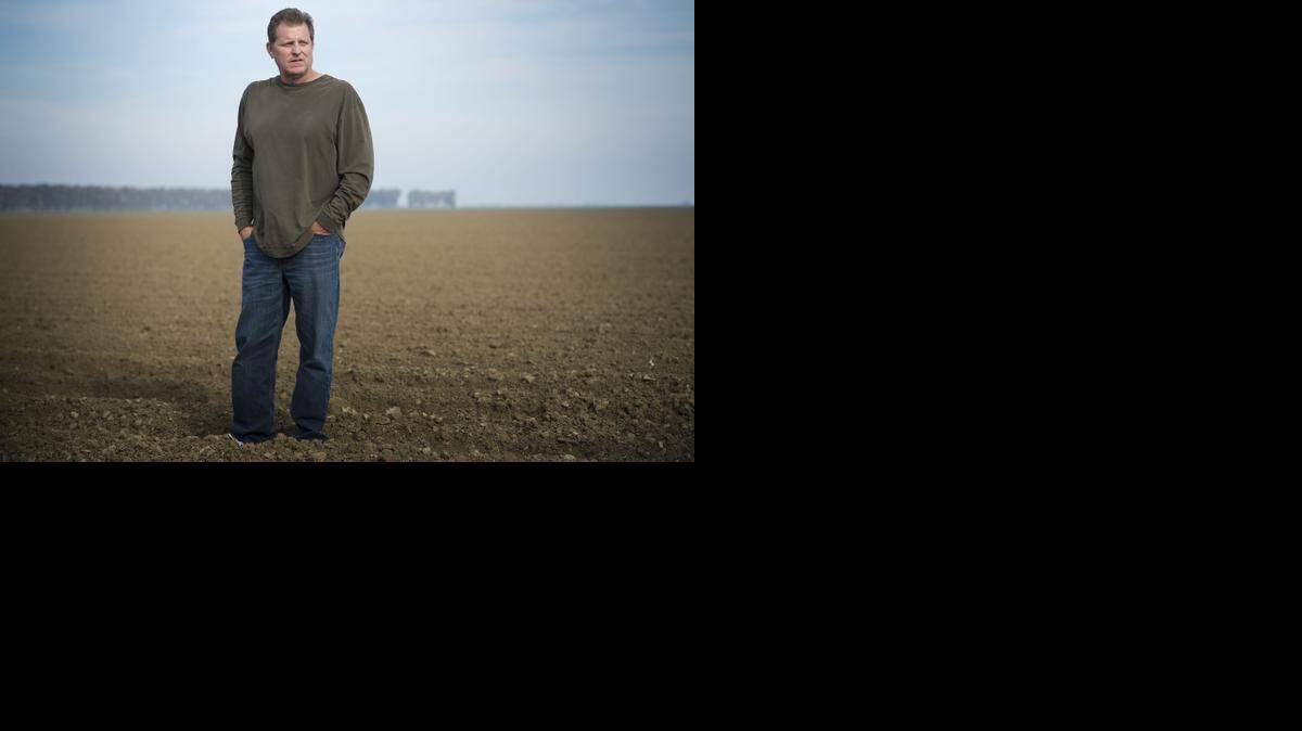 
Todd Allen of Fresno stands on his Firebaugh, Calif., farm that was handed down from his father and that he struggles to keep because of the lack of water. 
