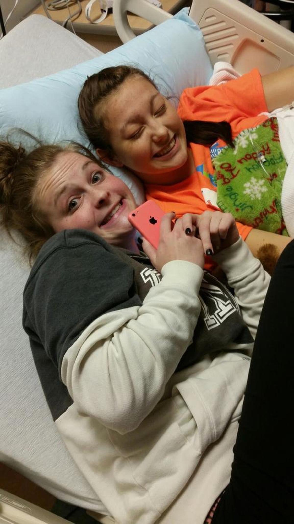 Mackenzie Hamann hangs out with her cousin, Hayley Illig, in 2015 at St. Louis Children’s Hospital, where Hayley stayed for two weeks after being diagnosed with Wilson’s disease.