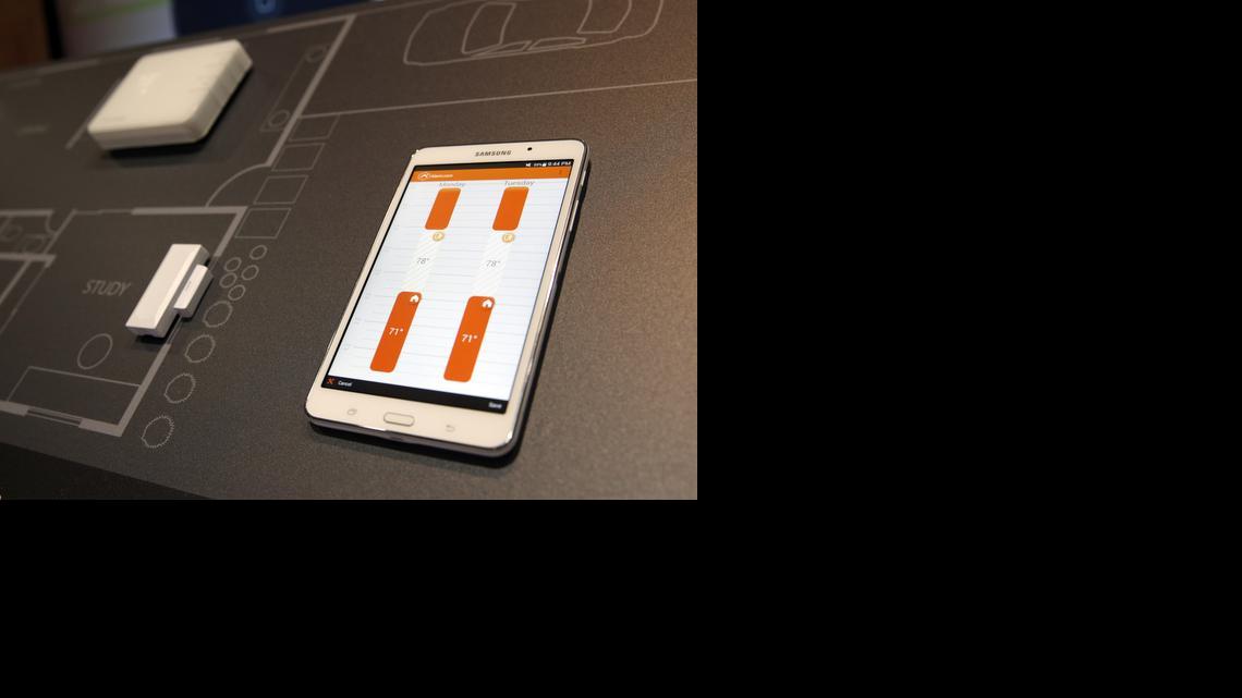 
The Alarm.com smart thermostat and application are on display at CES Unveiled, a media preview event for CES International, Sunday, Jan. 4, 2015, in Las Vegas.
