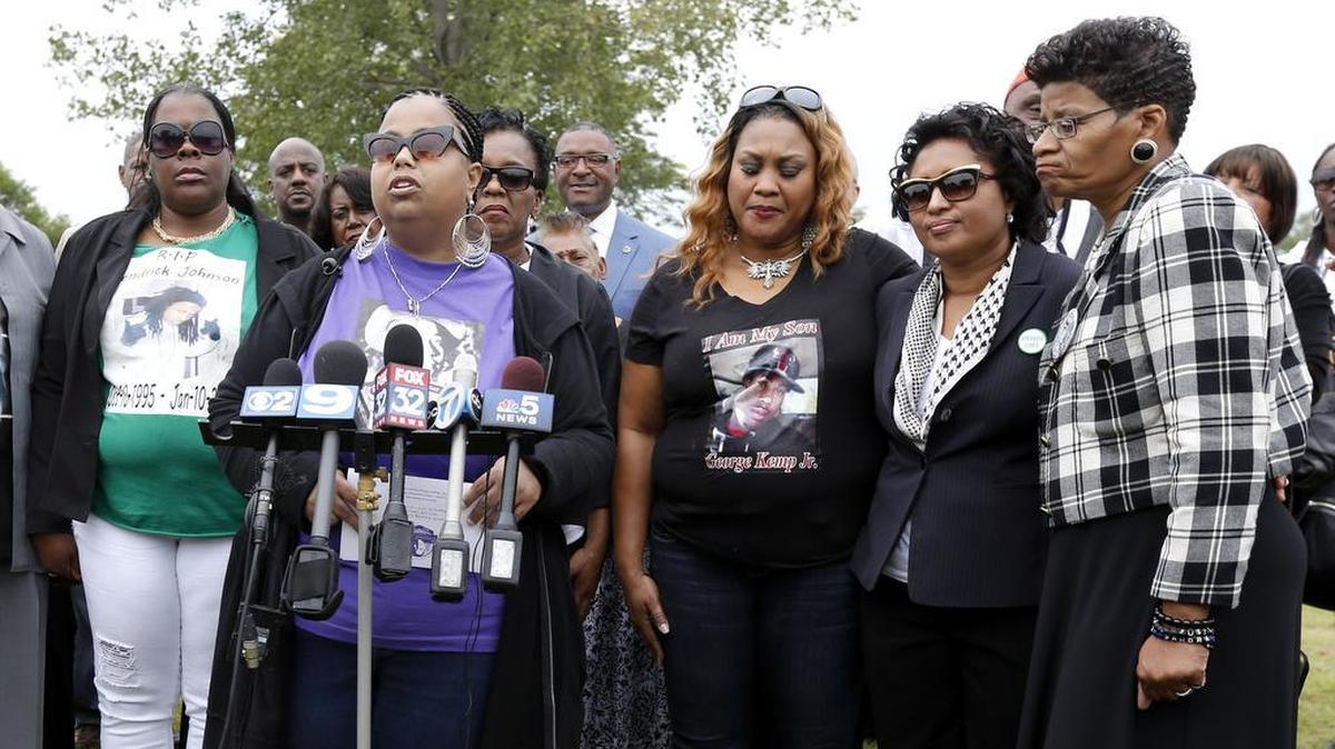 
Airickca Gordon Taylor, second from left, Emmett Till’s cousin and co-founder of the Mamie Till Mobley Memorial Foundation, addresses the crowd gathered on Friday, Aug. 28, 2015, at a gravesite ceremony at the Burr Oak Cemetery in Alsip, Ill., marking the 60th anniversary of the murder of Till in Mississippi. Standing with Taylor are Jackie Johnson, left, mother of Kendrick Johnson; Geneva Reed-Veal, mother of Sandra Bland, right; Kadiatou Diallo, mother of Amadou Diallo, second from right; and Calandrian Kemp, mother of George Kemp Jr., third from right. 
