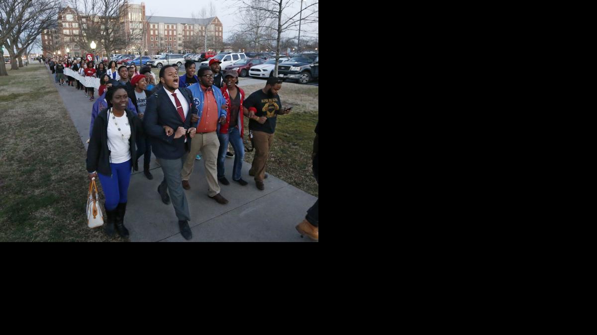 
University of Oklahoma students march to the now closed University of Oklahoma's Sigma Alpha Epsilon fraternity house during a rally in Norman, Okla., Tuesday, March 10, 2015. The university's president expelled two students Tuesday after he said they were identified as leaders of a racist chant captured on video during a fraternity event. 
