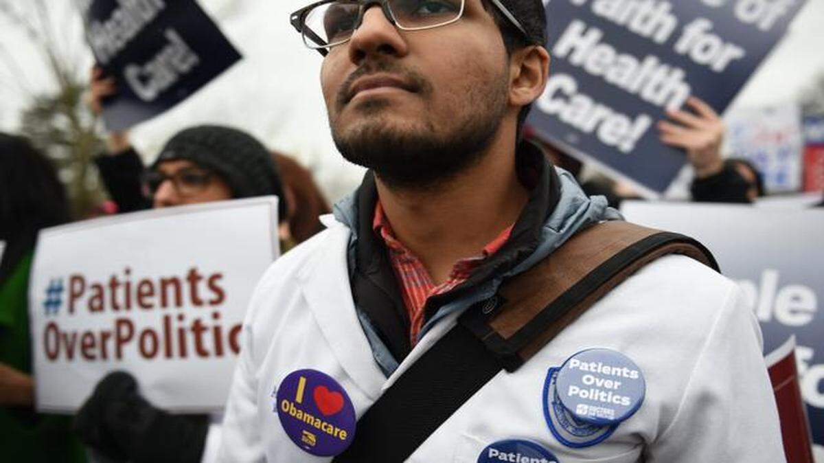 
Anish Mehta, a medical student at Case Western Reserve University School of Medicine in Cleveland, Ohio, demonstrates outside the U.S. Supreme Court as the court hears oral arguments challenging a key provision of the Affordable Care Act, in Washington, D.C., on March 4, 2015. Immediately at stake are the tax-credit subsidies that have helped make health insurance affordable for millions of Americans in dozens of states.
