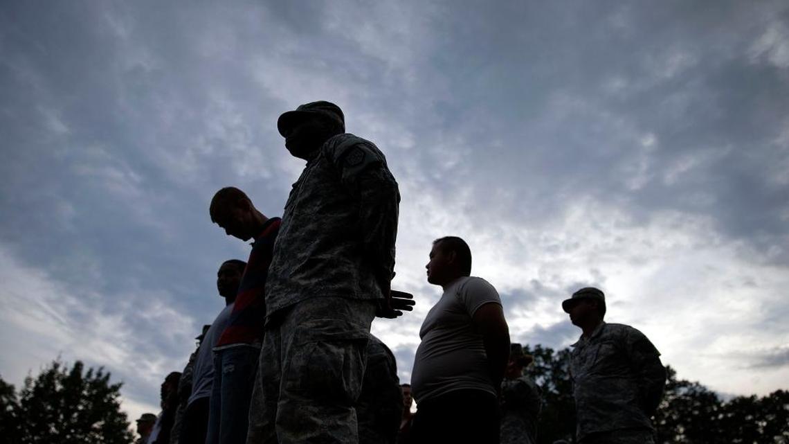 Pvt. Norman Davis, of Bamberg, S.C., front, stands during roll call with fellow soldiers from the Georgia National Guard 876th Vertical EN Company, on the eve the unit deploys to Afghanistan, Thursday, May 29, 2014, in Toccoa, Ga. The unit's deployment marks the last for the Georgia Army National Guard to Afghanistan as the military looks to withdrawal all but some 10,000 troops after 2014.