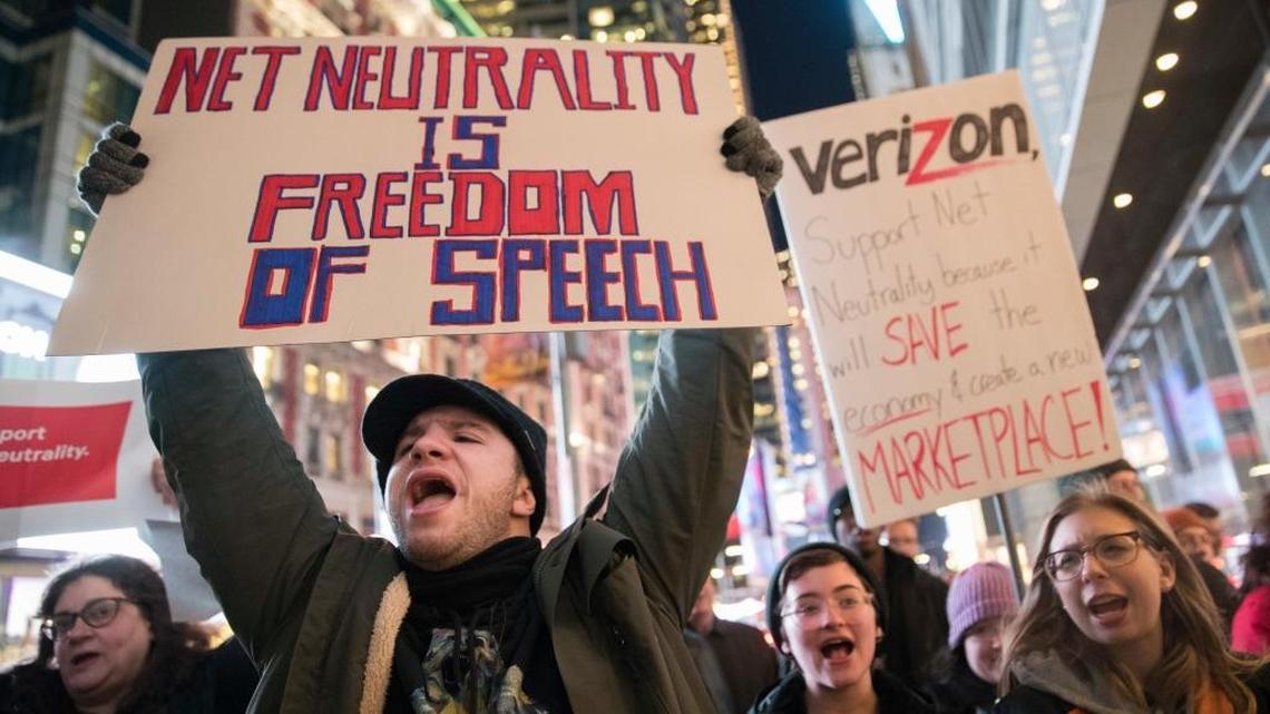 Demonstrators rally in support of net neutrality outside a Verizon store on Dec. 7 in New York. The Federal Communications Commission voted Thursday to scrap Obama-era rules around open internet access that prevent phone and cable companies from favoring certain websites and apps.