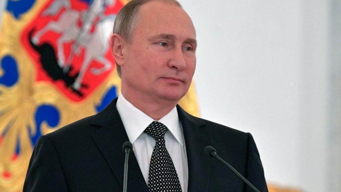 Russian President Vladimir Putin speaks at a reception marking Heroes of the Fatherland Day in the Kremlin in Moscow, Russia, Friday, Dec. 9, 2016.