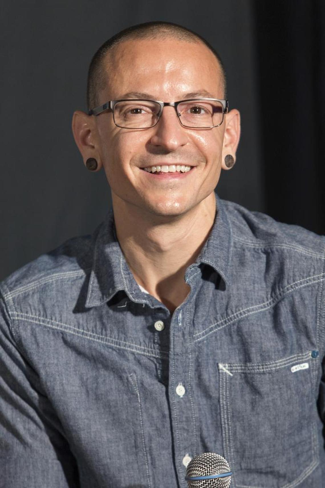 Chester Bennington of Linkin Park attends Linkin Park’s induction into the Guitar Center’s RockWalk on June 18, 2014, in Los Angeles. The Los Angeles County coroner says Bennington, who sold millions of albums with a unique mix of rock, hip-hop and rap, has died in his home near Los Angeles. He was 41.