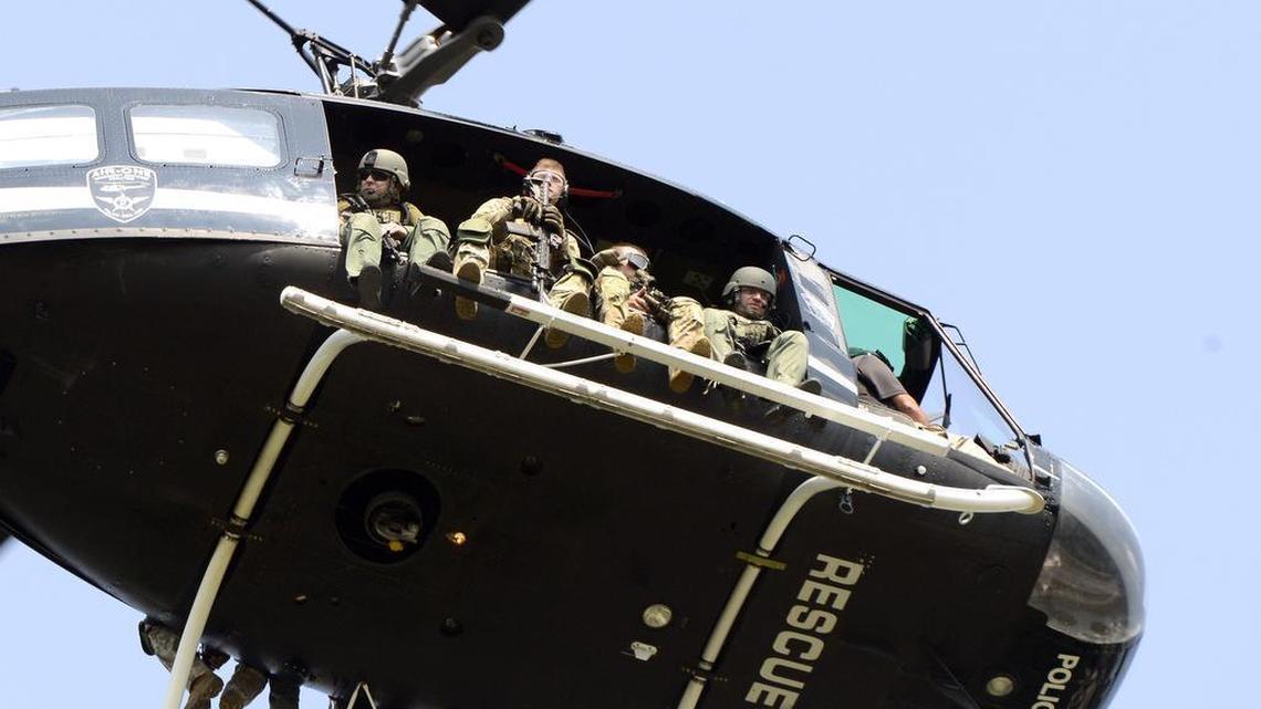 
Police search from a helicopter for suspects in the shooting of a police officer, Tuesday, Sept. 1, 2015 in Fox Lake, Ill. Fox Lake Police Lt. Charles Joseph Gliniewitz was shot and killed Tuesday. Police with helicopters, dogs and armed with rifles are conducting a massive manhunt in northern Illinois for the individuals believed to be involved in the death of the three-decade member of the department and a father of four sons. 
