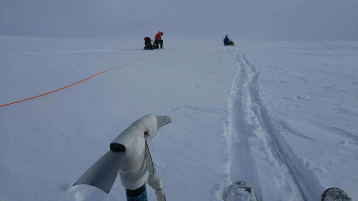 A four-man rescue team from the Alaska Air National Guard skis on top of the Harding Ice Field to rescue two stranded skiers Monday. Poor weather meant a helicopter had to leave them 15 miles away from where the two skiers had hunkered down in a snow cave for four nights.