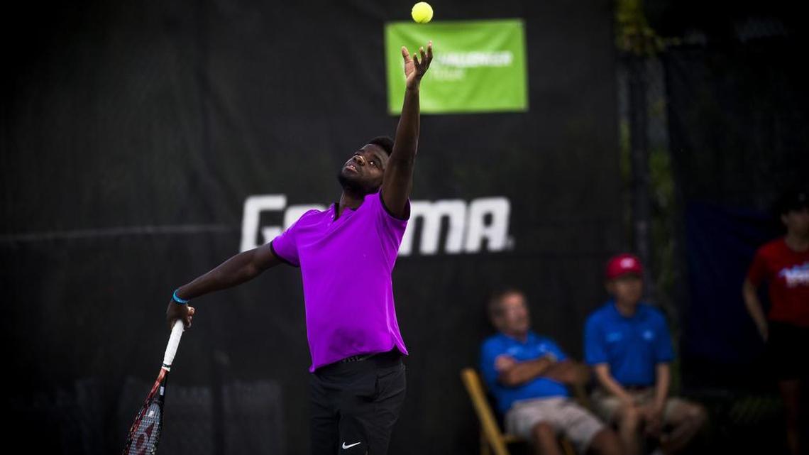 Frances Tiafoe serves as he faces off against Henri Laaksonen in the quarter finals of the Sarasota Open tennis tournament on Friday evening at the United Tennis Academy in Bradenton.