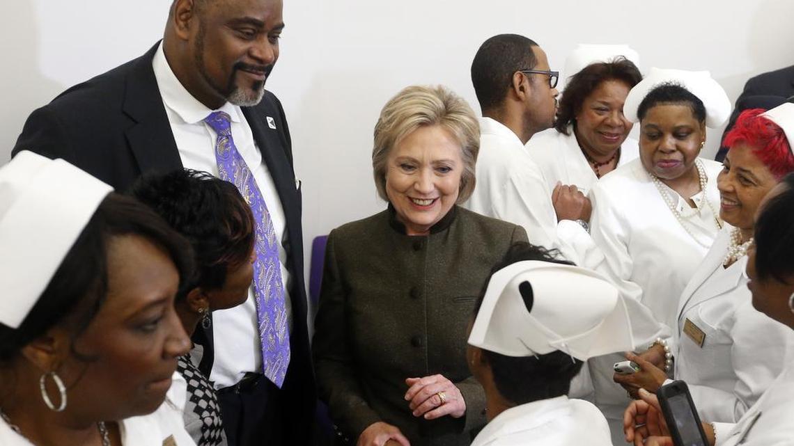 Democratic presidential candidate Hillary Clinton meets members of the House of Prayer Missionary Baptist Church on Sunday, Feb. 7, 2016, in Flint, Mich.