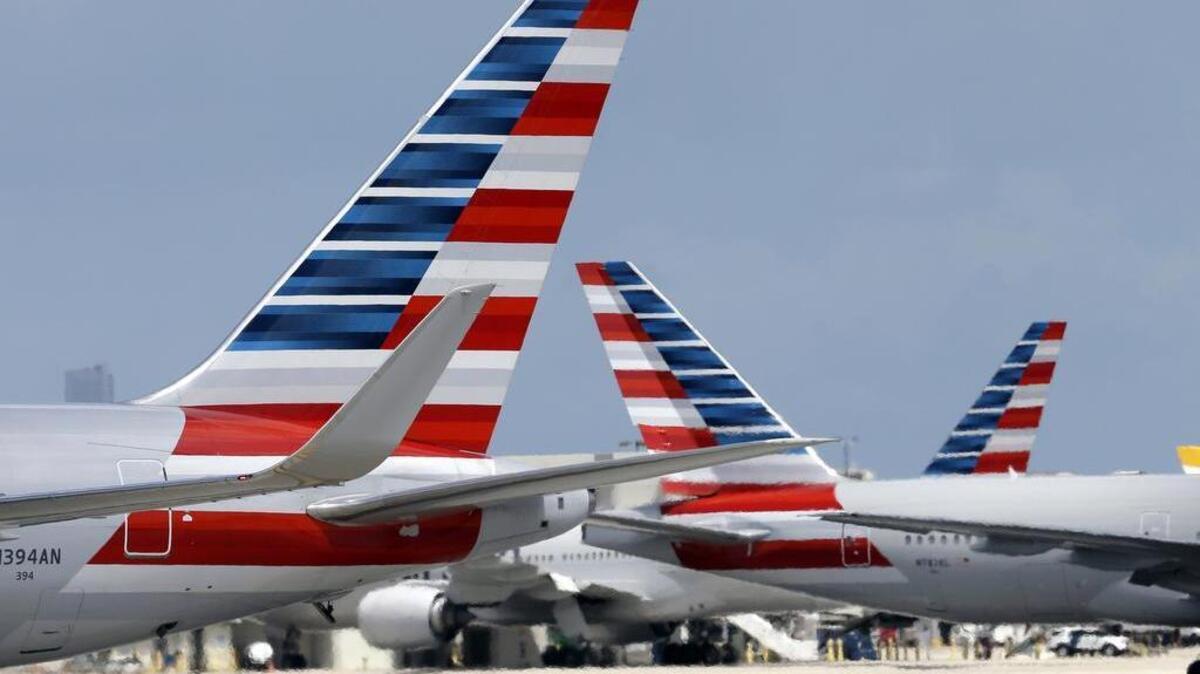 
American Flight 550 was diverted shortly after 7 a.m. Monday, Oct. 5, 2015, and the first officer safely landed the plane with 147 passengers and five crew members onboard. The captain became ill and died.
