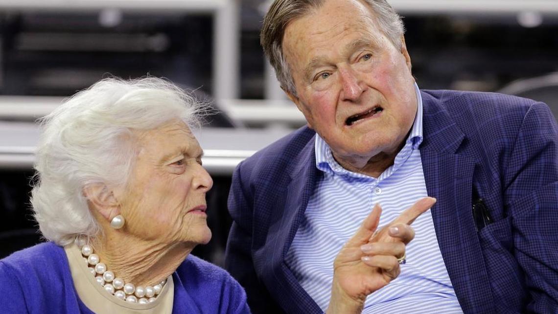 In this March 29, 2015, file photo, former President George H.W. Bush and his wife, Barbara Bush, speak at a college basketball game in Houston.
