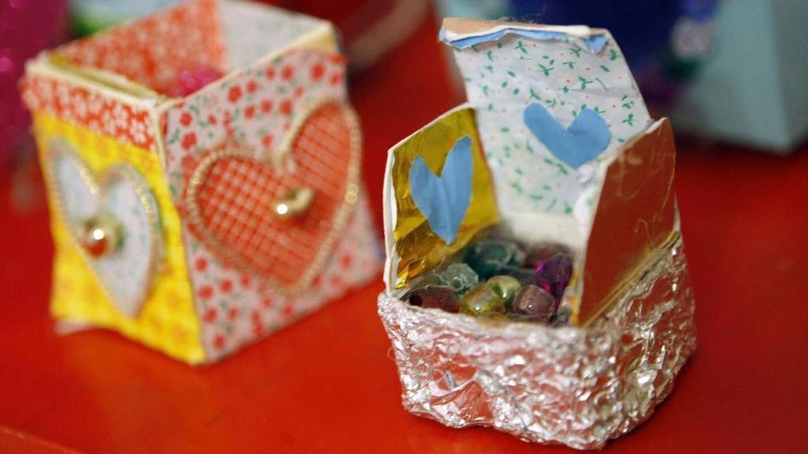 
Illustrator Emily Green has created a brand of housewares devoted to kids. Here, a collection of tooth fairy boxes is displayed. 
