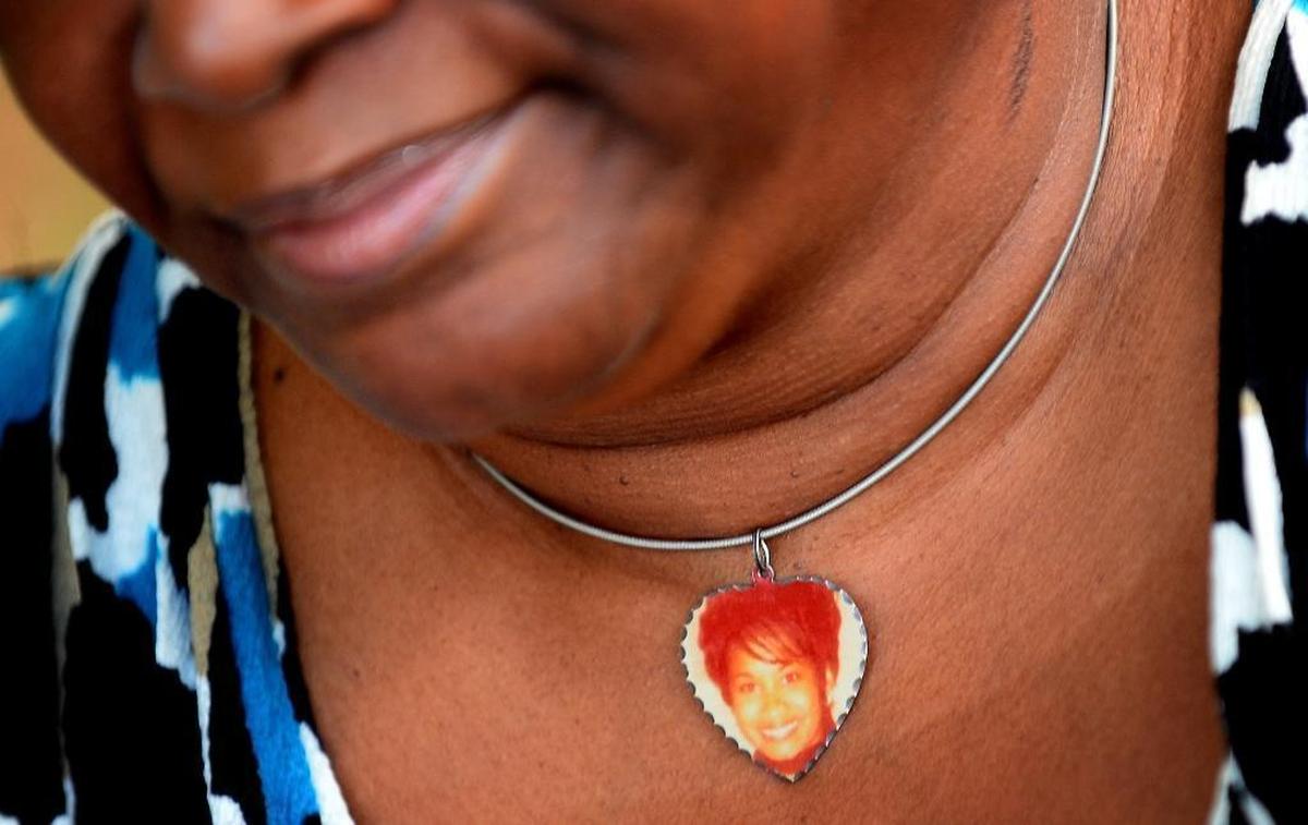 Saundra Adams frequently wears a necklace with a photo of her daughter, Cherica Adams. Cherica Adams died as a result of four gunshot wounds in 1999, but her son Chancellor Lee Adams lived. The picture of Cherica enclosed in the necklace was taken only a few days before she was shot.