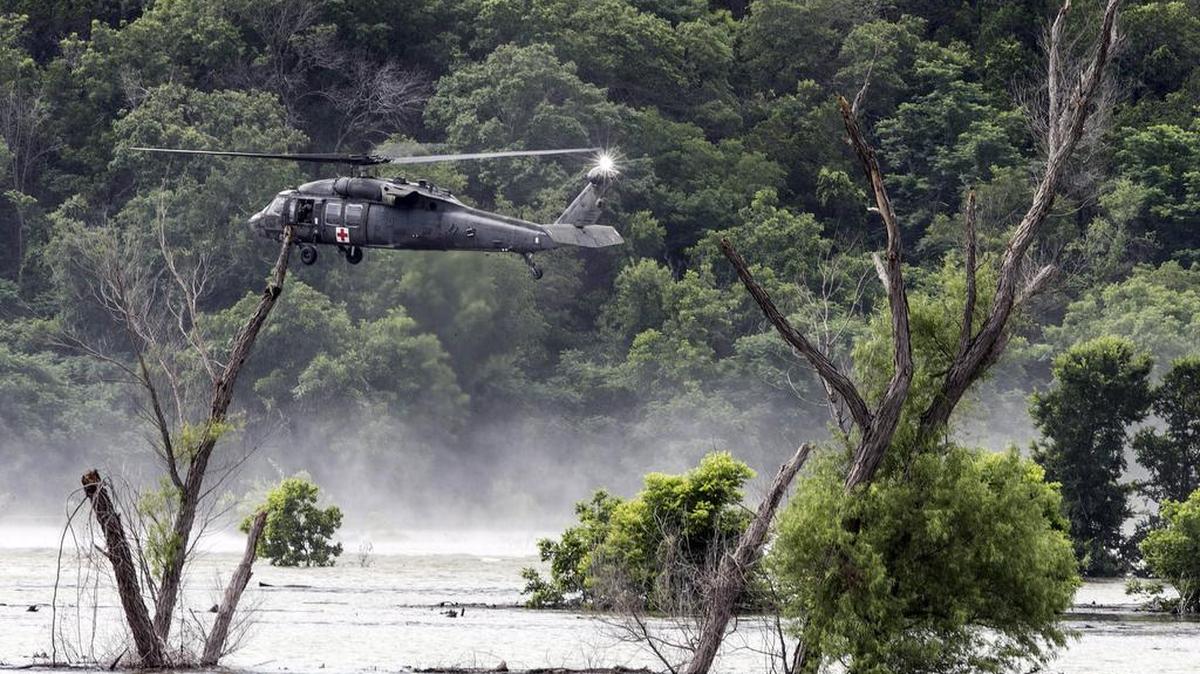 An Army helicopter searchs for four missing soldiers above Lake Belton on Friday. They were found later in the day.