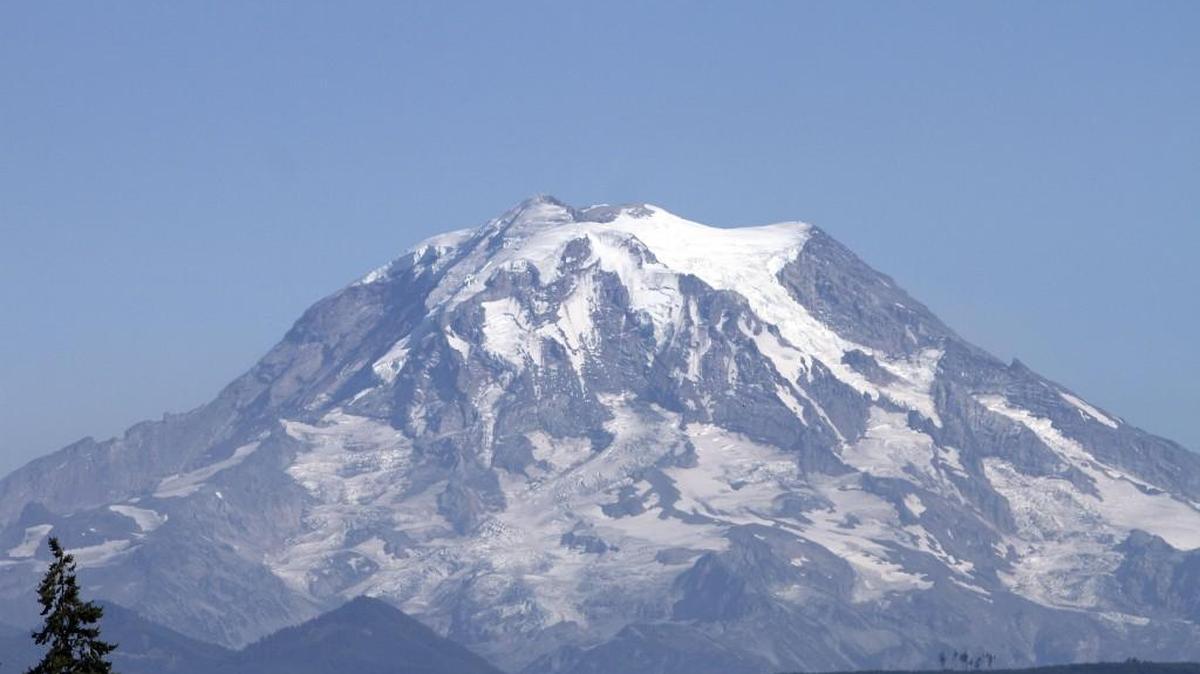 Two climbers were rescued Sunday morning after spending two nights in stormy conditions near the summit of Mount Rainier, park officials said Monday morning.