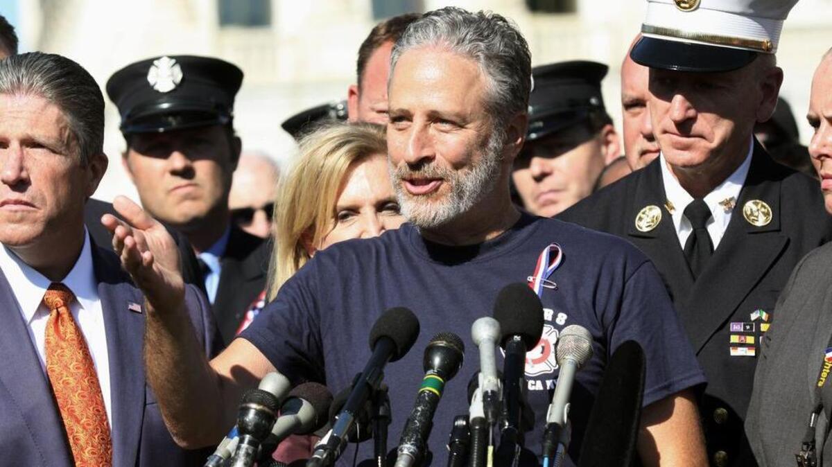 
Comedian Jon Stewart stands with New York City first responders during a rally on Capitol Hill in Washington, Wednesday, September 16, 2015, calling for the extension of the the Zadroga Heath & Compensation Act, which provides health care and compensation to 9/11 first responders and victims.
