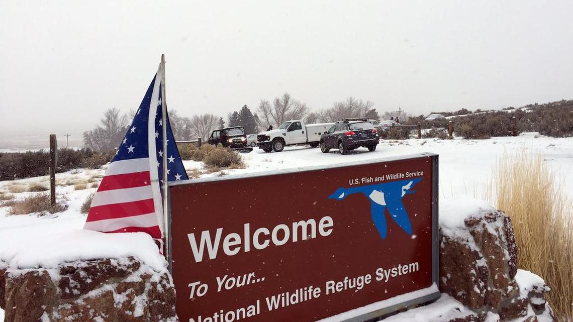 An sign of the National Wildlife Refuge System is seen at an entry of the wildlife refuge about 30 miles southeast of Burns, Ore., on Sunday. Armed protesters are occupying a building at the national wildlife refuge and asking militia members around the country to join them. The protesters went to Malheur National Wildlife Refuge on Saturday following a peaceful rally in support of two Oregon ranchers facing additional prison time for arson.