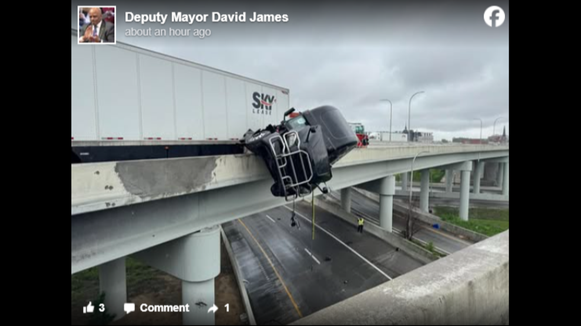 A semitruck hangs over an overpass after a crash in Kentucky.