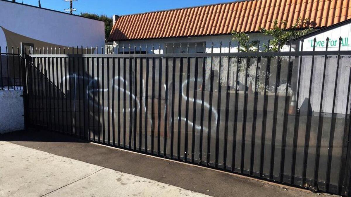 Someone spray-painted “Jesus” on a gate at the Ahmadiyya Muslim Community Baitus-Salaam Mosque in Hawthorne, Calif., on Sunday. The FBI is investigating after police in Hawthorne say two mosques in that city were vandalized and a fake grenade was left in the driveway of one of the properties.